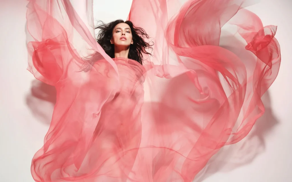 Irina Shayk posing in sheer pink fabric for Pirelli 2026 calendar
