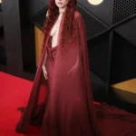 Chappell Roan red carpet look with chiffon wrap and sheer dress