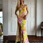 Alexis Ren in floral halter dress with high slit for Mirror Palais October 2025 shoot