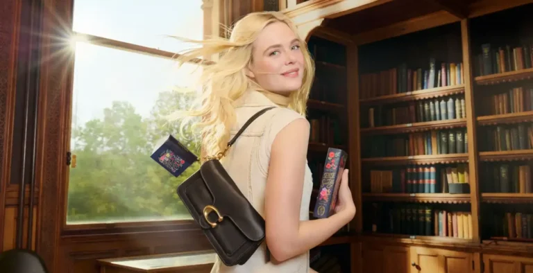 Elle Fanning reading with Coach Tabby bag spring 2026 campaign