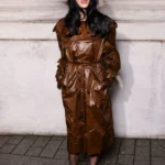 Gabbriette wearing caramel brown trench coat Paris Fashion Week