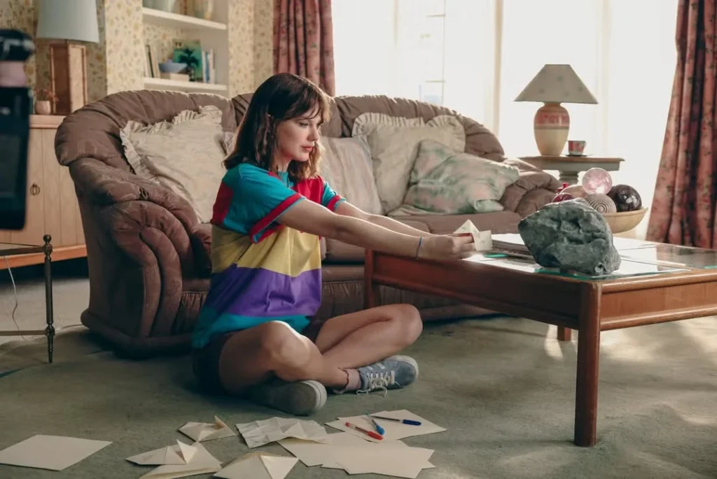 Taylor Swift wearing a vintage polo in the Opalite music video